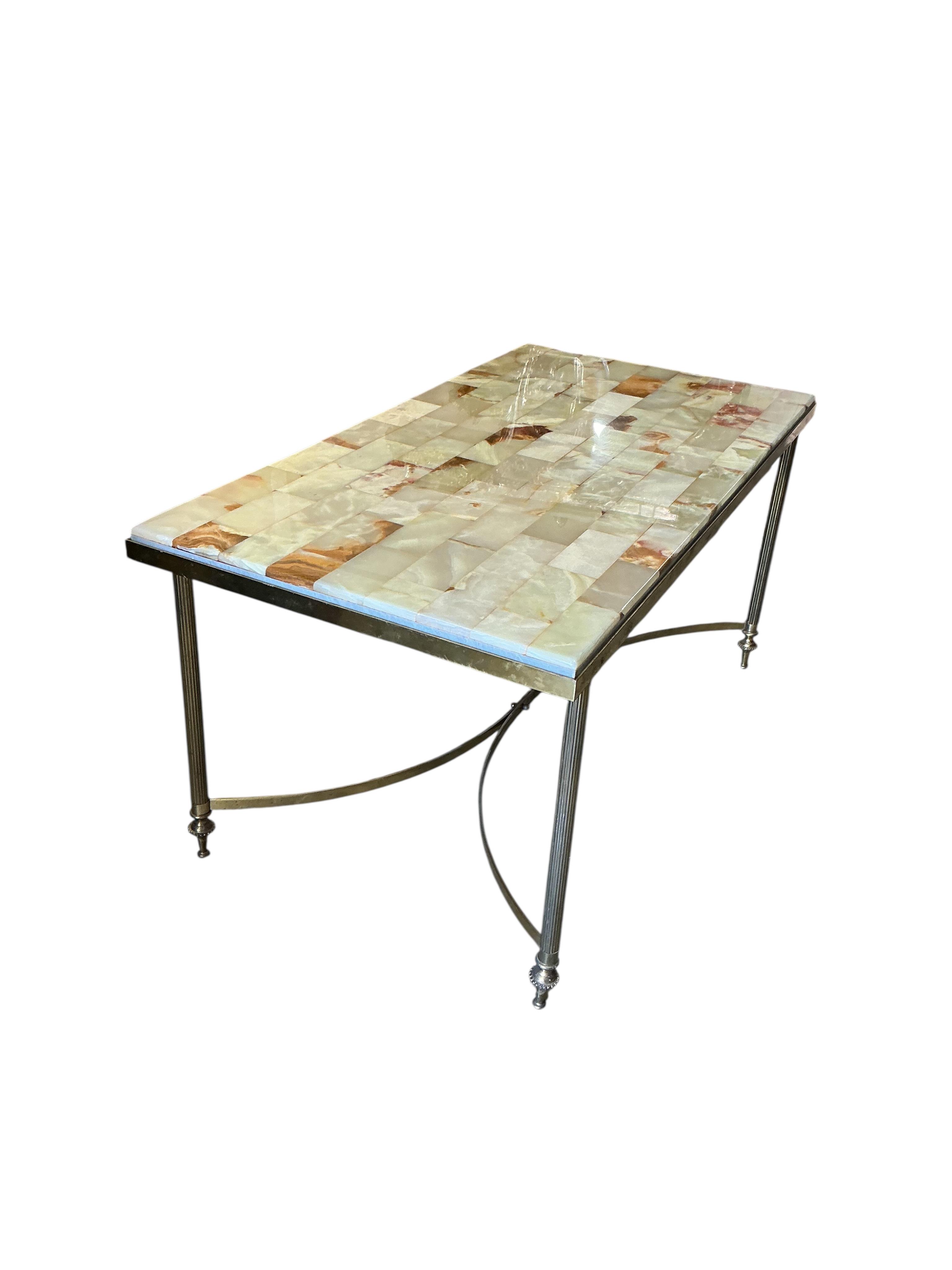 A rectangular brass and onyx coffee table, width 87cm, depth 46cm, height 42cm